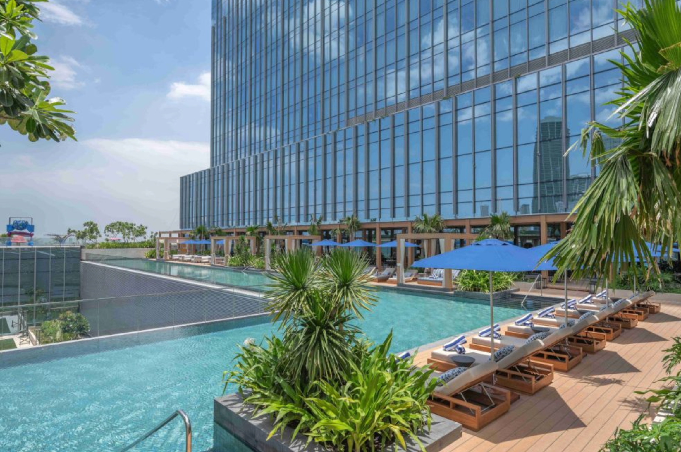 The L-shaped pool at Solaire Resort North overlooks the Quezon City horizon
