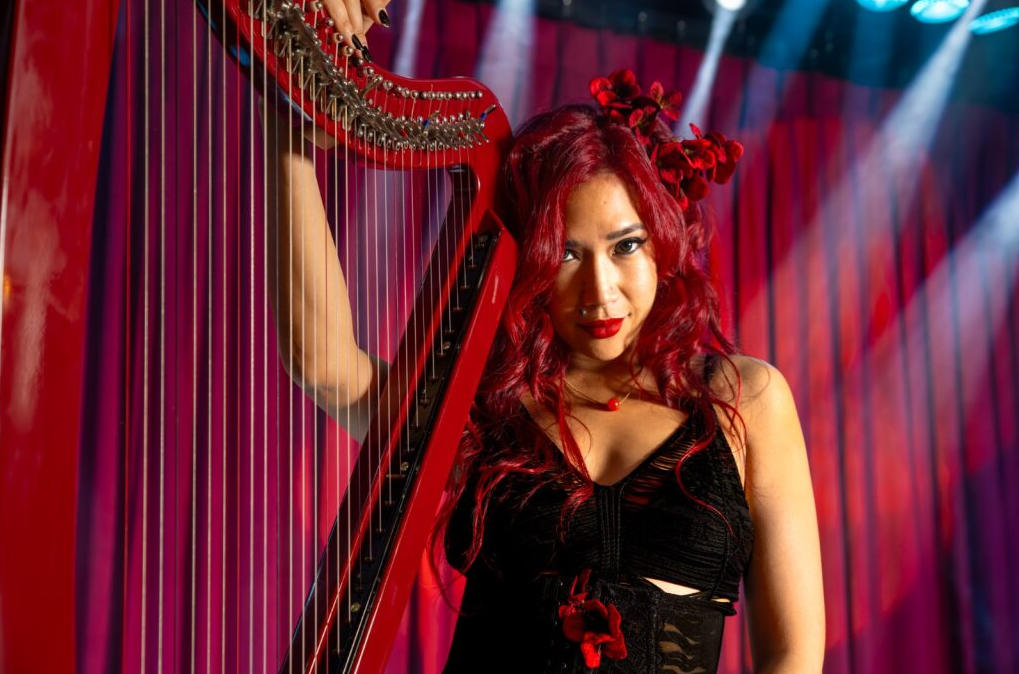 Heloise La Harpe opens the evening performance line-up at Quezon Club with her sultry harp tunes to serenade partygoers through Halloween