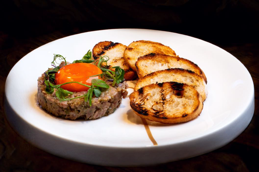 Experience timeless classics made with modern flair at Quezon Club such as one of their appetizers, the Beef Tartare