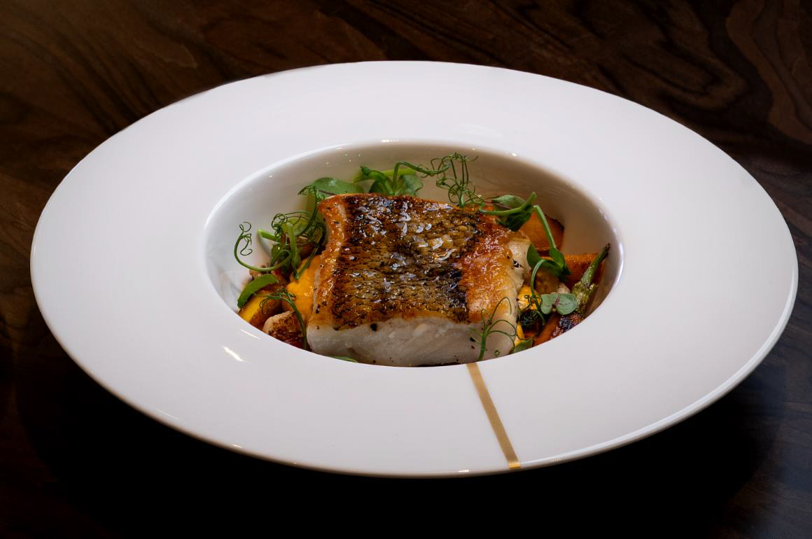 The Chilean Seabass made with burst vine tomato, cauliflower, carrots, and a delicious curry Hollandaise keeps you wanting more